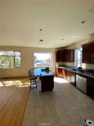 a large kitchen with lots of counter space and windows