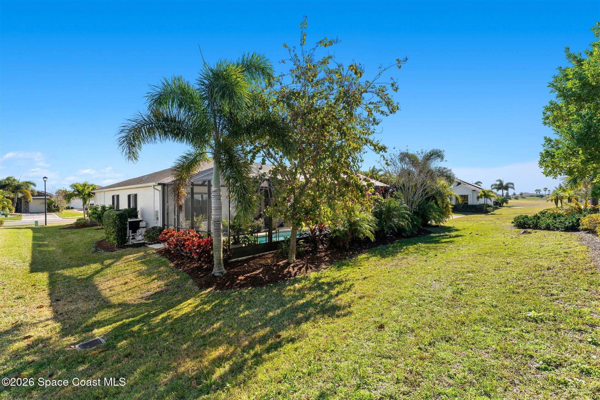 2622 Chapel Bridge Lane Melbourne, FL 32940 - Photo 57 of 92 Added Trees and Landscaping