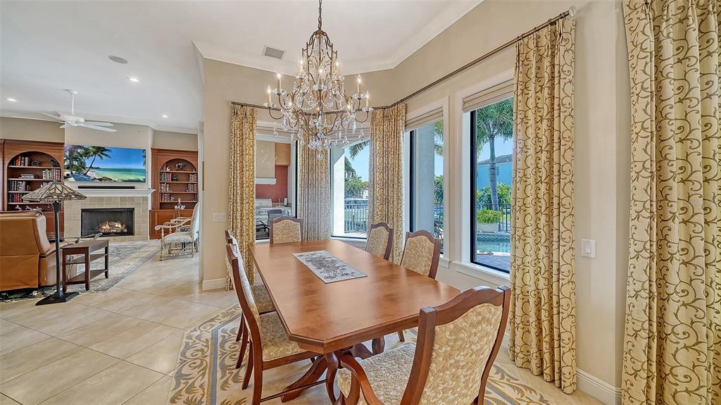 1005 Bogey Lane Longboat Key, FL 34228 - Photo 15 of 69 a view of a dining room with furniture window and outside view