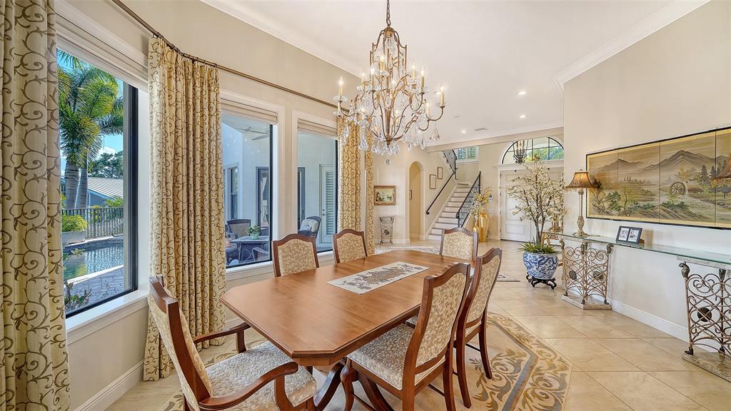 1005 Bogey Lane Longboat Key, FL 34228 - Photo 16 of 69 a view of a dining room with furniture window and outside view