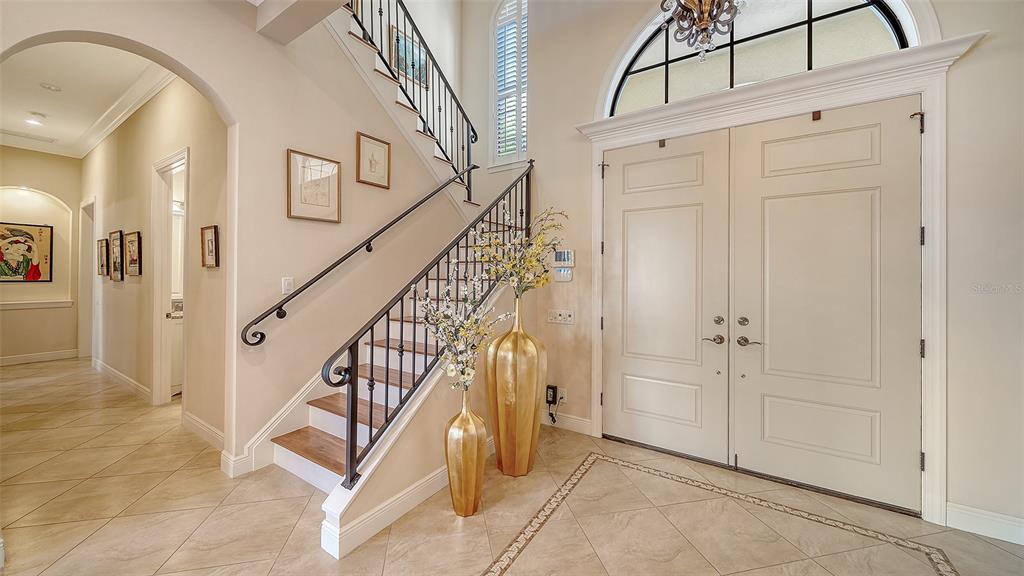 1005 Bogey Lane Longboat Key, FL 34228 - Photo 24 of 69 a view of an entryway with wooden floor