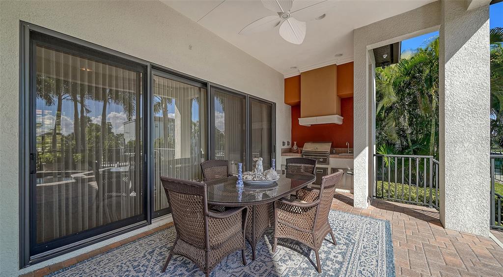 1005 Bogey Lane Longboat Key, FL 34228 - Photo 46 of 69 a view of a dining room with furniture window and outside view