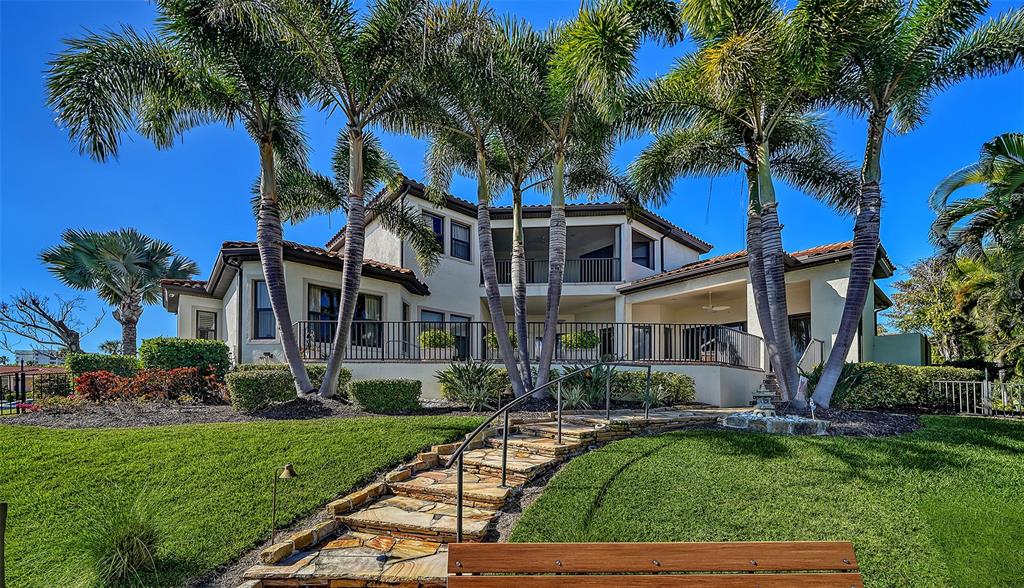 1005 Bogey Lane Longboat Key, FL 34228 - Photo 59 of 69 a view of a house with a yard