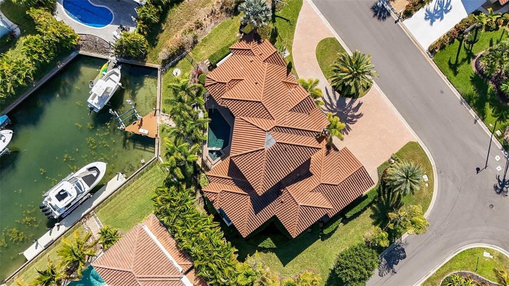 1005 Bogey Lane Longboat Key, FL 34228 - Photo 61 of 69 an aerial view of a house with swimming pool and outdoor space