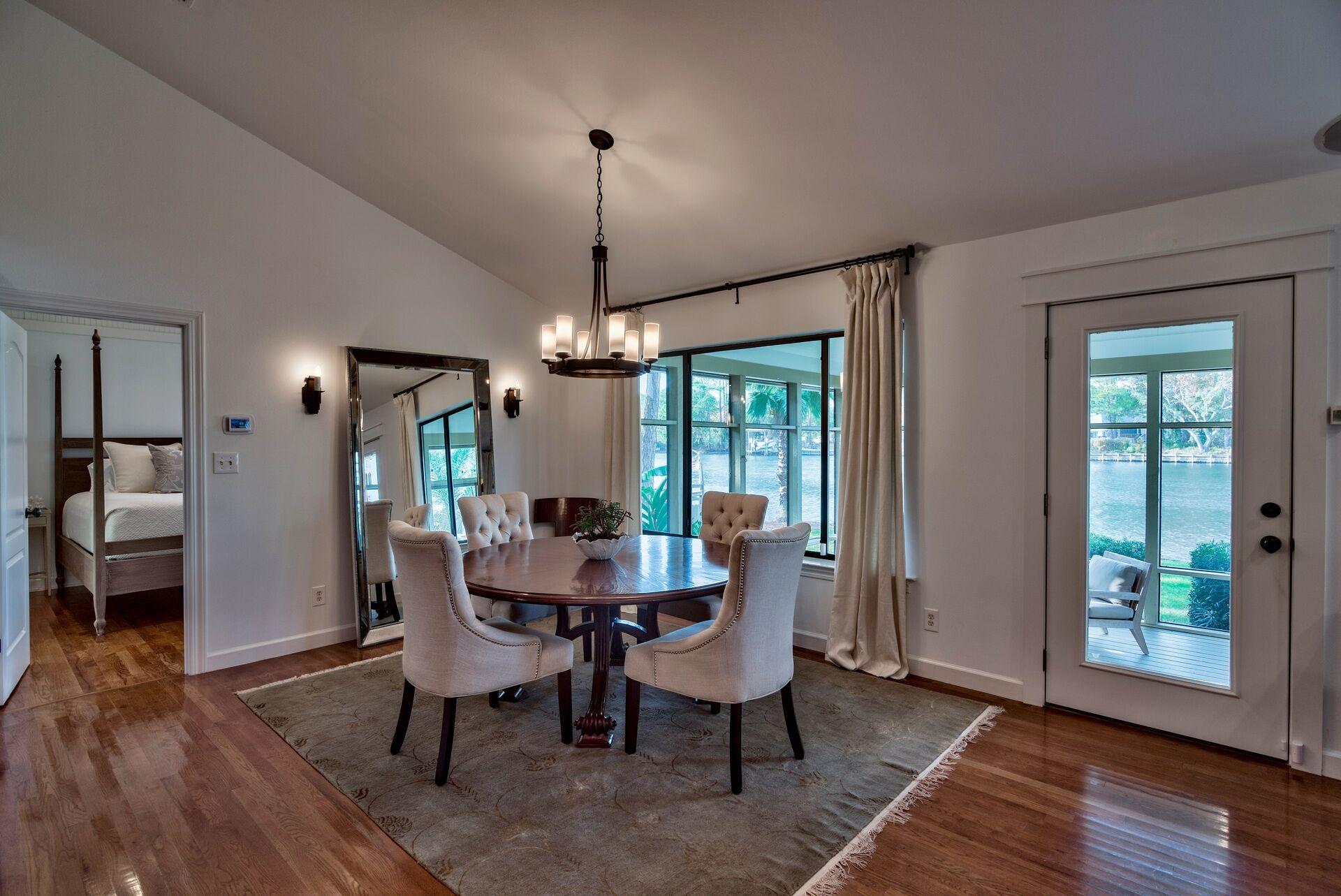 134 My Way Santa Rosa Beach, FL 32459 - Photo 23 of 48 a view of a dining room with furniture window and wooden floor