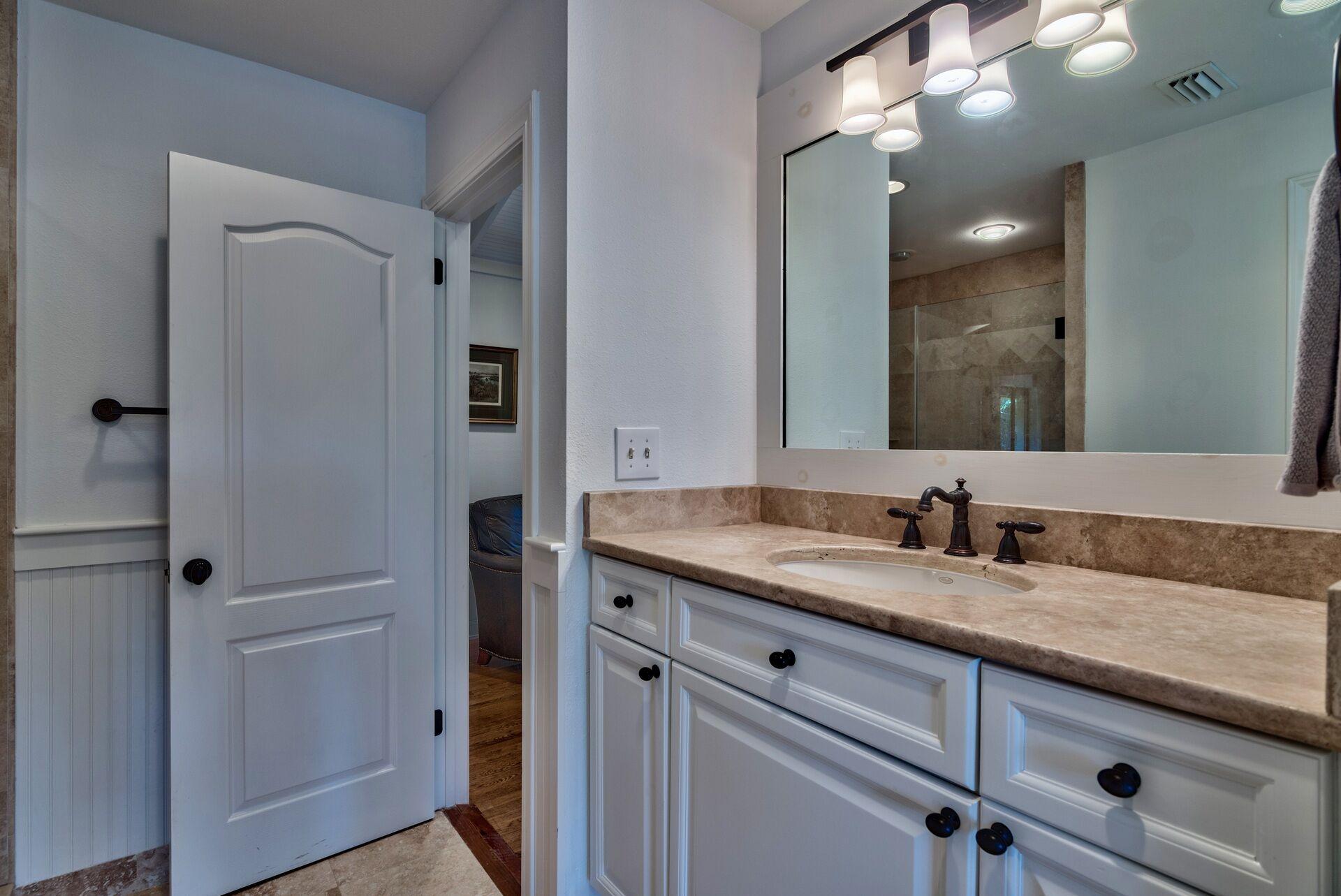 134 My Way Santa Rosa Beach, FL 32459 - Photo 38 of 48 a bathroom with a granite countertop sink and a mirror