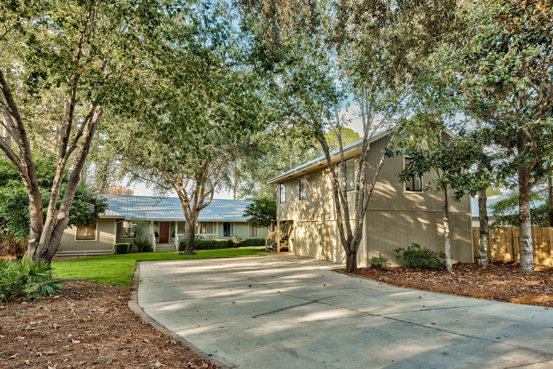 134 My Way Santa Rosa Beach, FL 32459 - Photo 5 of 48 a view of street with a building and trees in the background