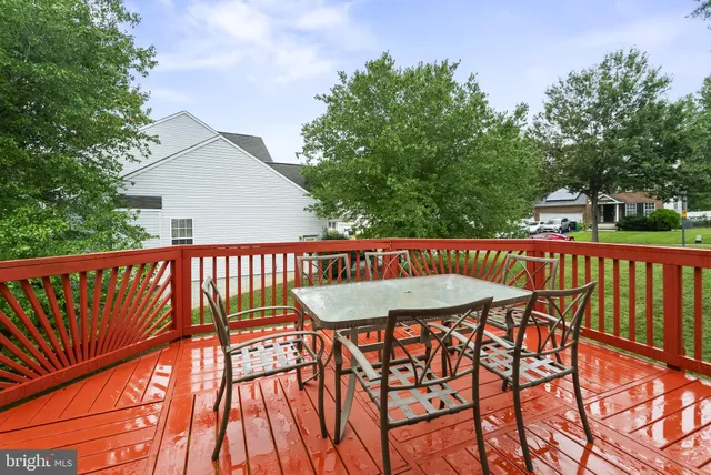 a balcony with table and chairs