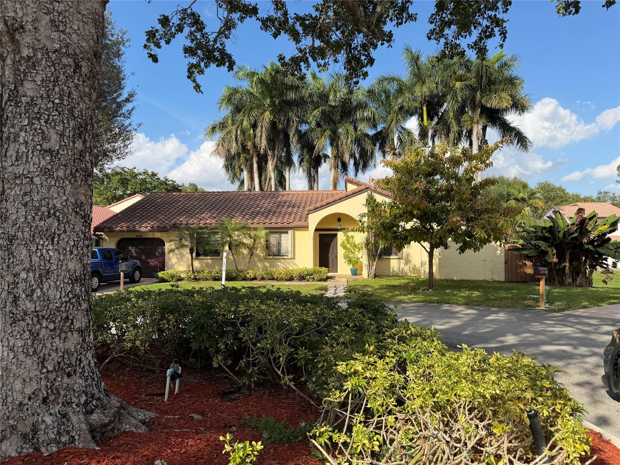2925 Azalea Drive Hollywood, FL 33026 - Photo 1 of 13 a front view of a house with a yard