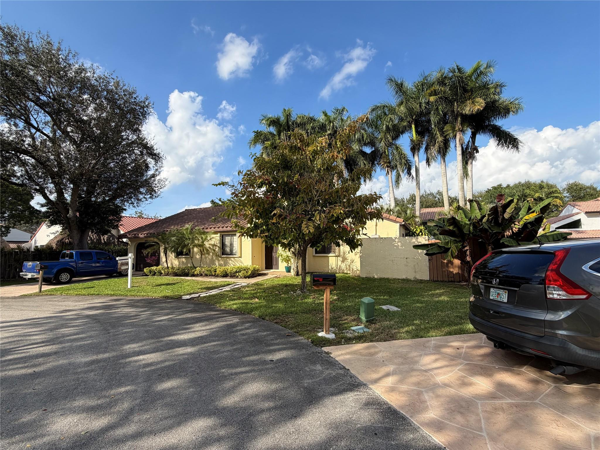 2925 Azalea Drive Hollywood, FL 33026 - Photo 2 of 13 a view of a house with a yard and entertaining space