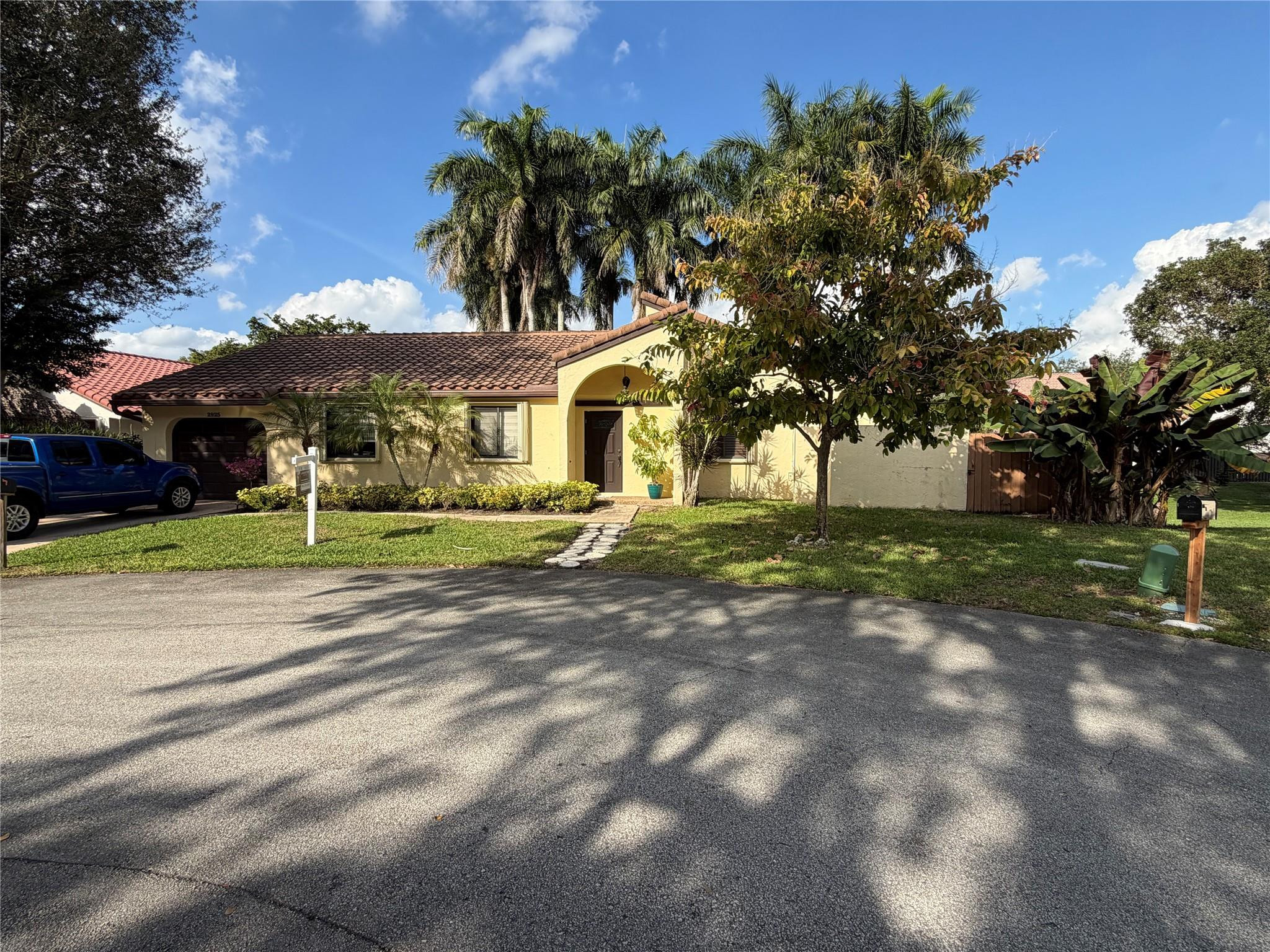 2925 Azalea Drive Hollywood, FL 33026 - Photo 3 of 13 a front view of a house with a yard