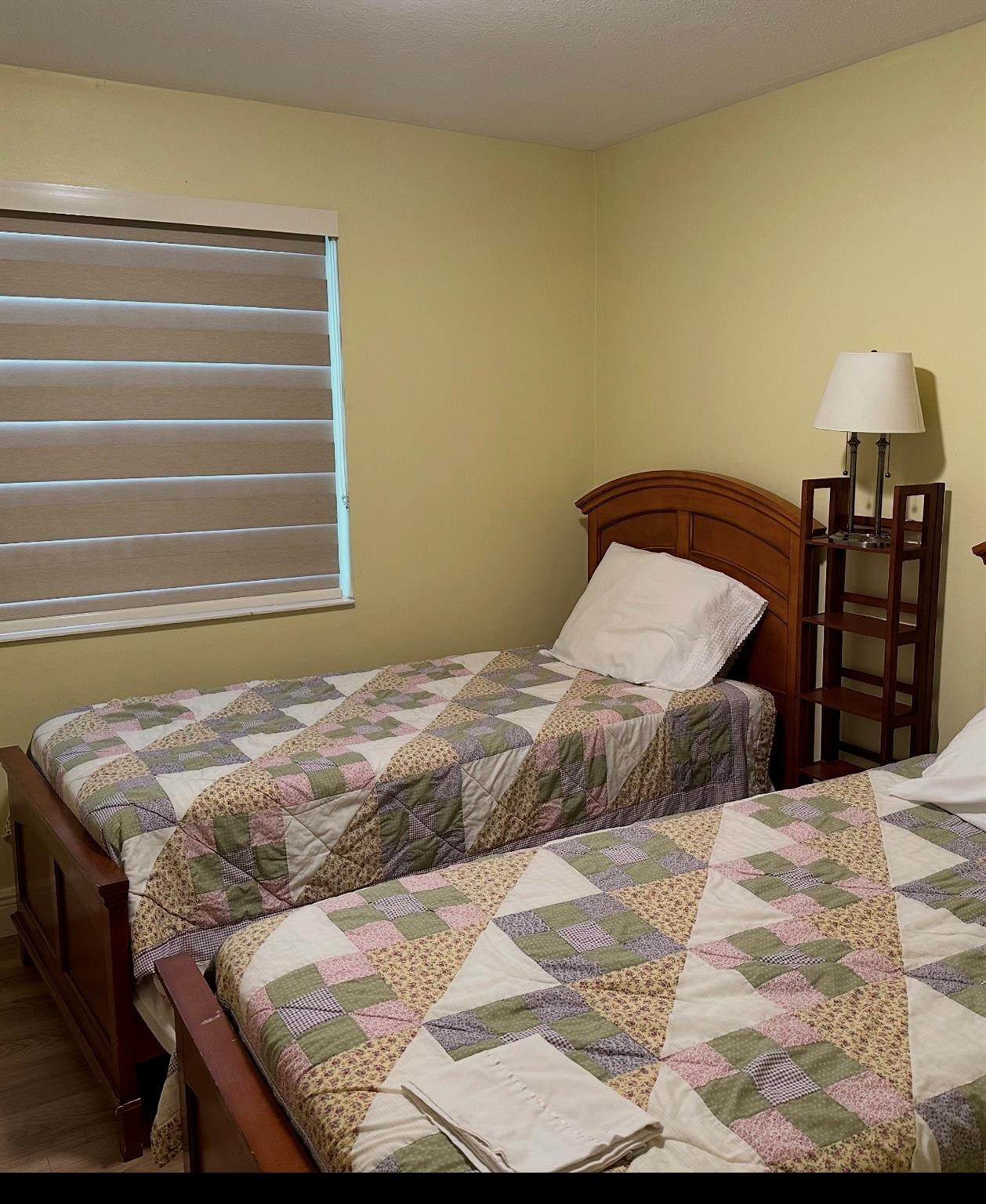 2925 Azalea Drive Hollywood, FL 33026 - Photo 6 of 13 a bedroom with a bed and wooden floor