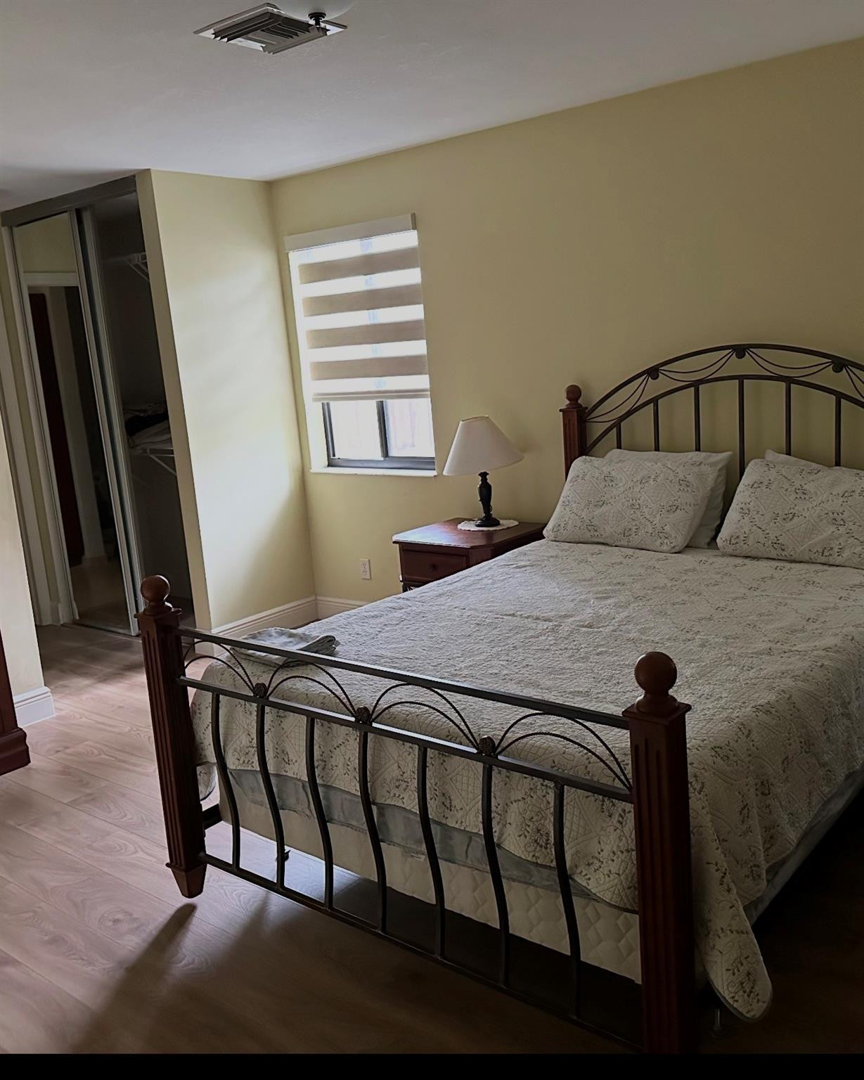 2925 Azalea Drive Hollywood, FL 33026 - Photo 7 of 13 a bedroom with a bed and wooden floor