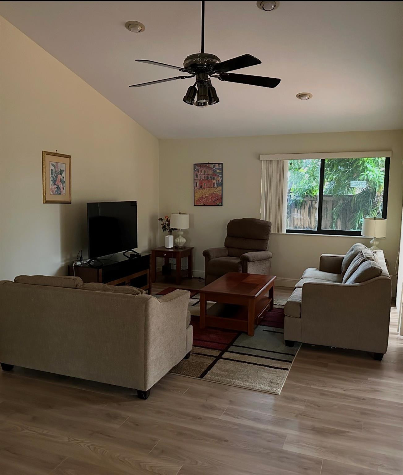 2925 Azalea Drive Hollywood, FL 33026 - Photo 8 of 13 a living room with furniture and a flat screen tv