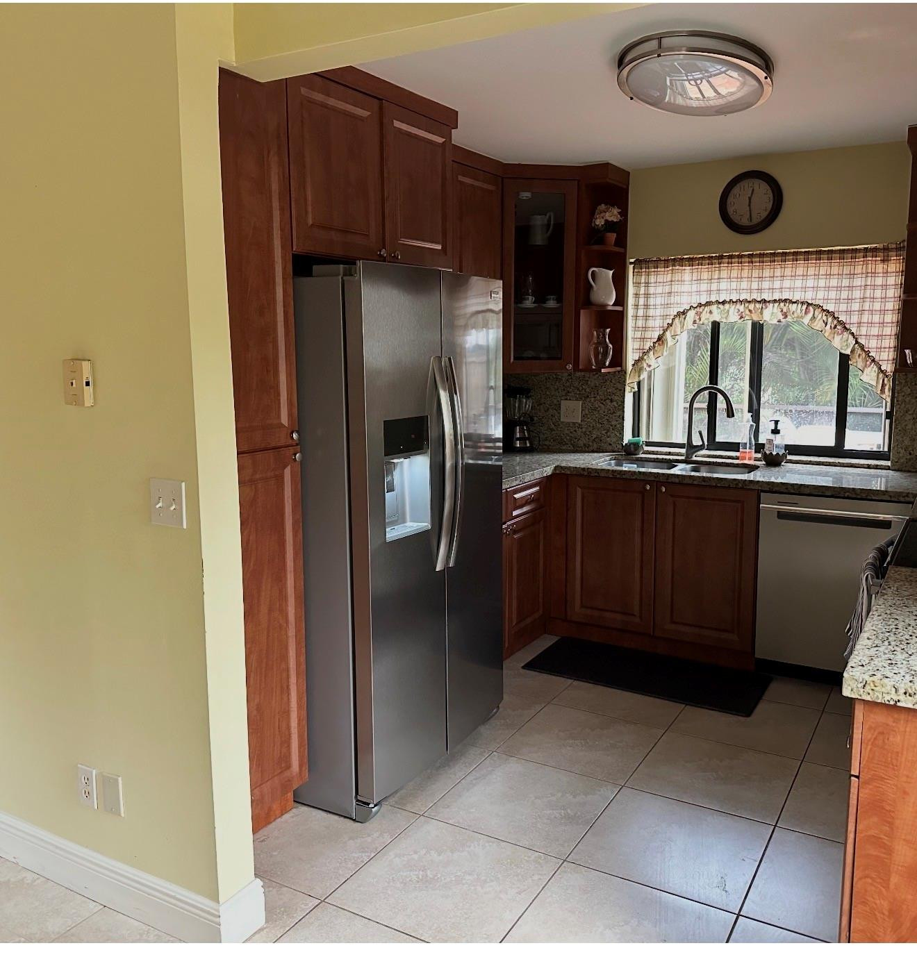 2925 Azalea Drive Hollywood, FL 33026 - Photo 10 of 13 a kitchen with stainless steel appliances granite countertop a refrigerator and a sink