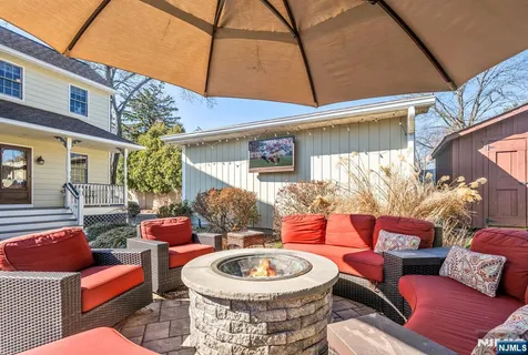 a patio with patio a couch and chairs