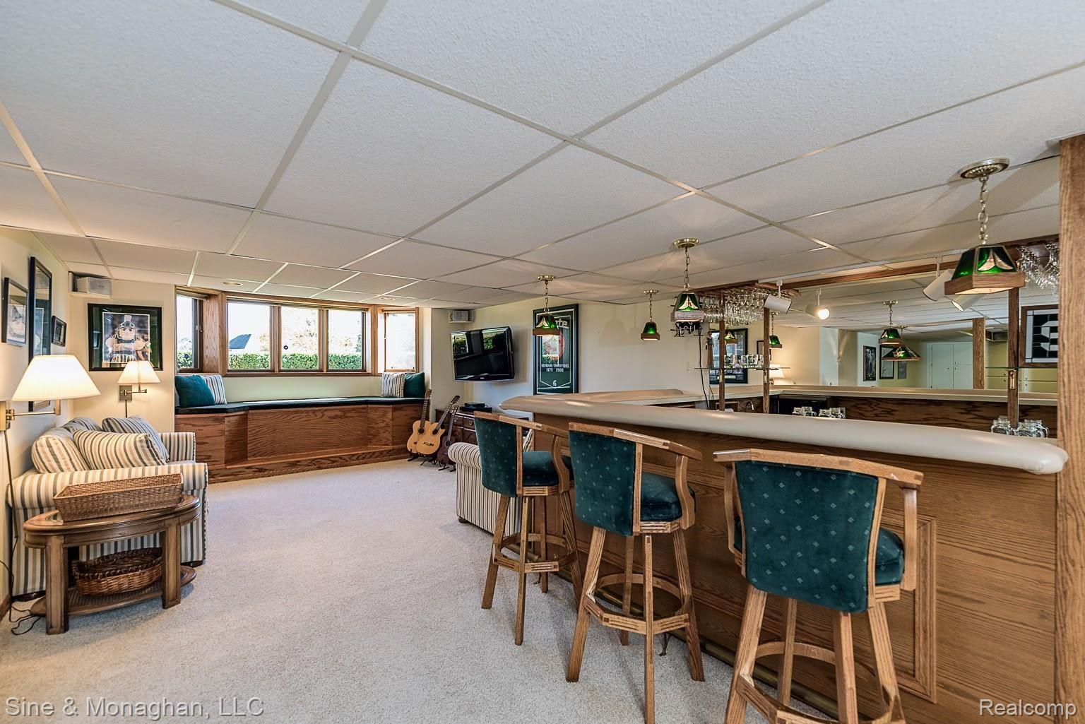 4906 Rivers Edge Drive Troy, MI 48098 - Photo 44 of 60 Fantastic lower level wet bar and hang out space