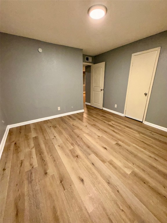 9100 Dodson Street, Unit 19 Houston, TX 77093 - Photo 11 of 16 an empty room with wooden floor
