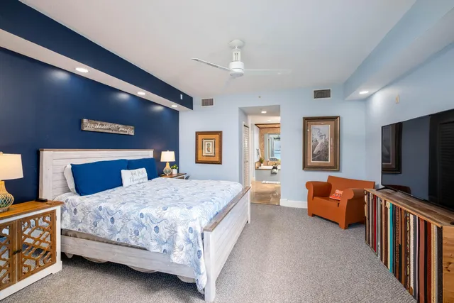 a living room with dining table and wooden floor