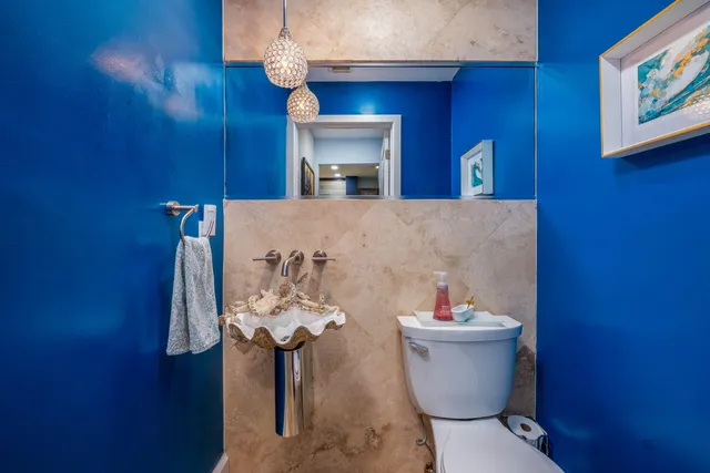 a view of a patio with table and chairs and potted plants