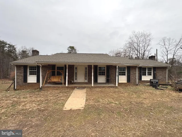 front view of a house with table and chairs