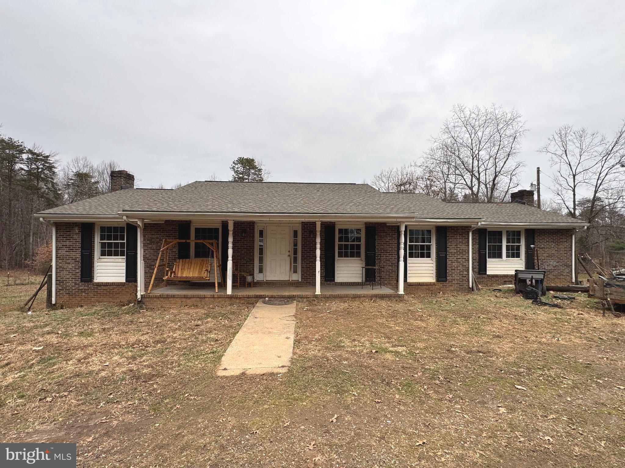 front view of a house with table and chairs