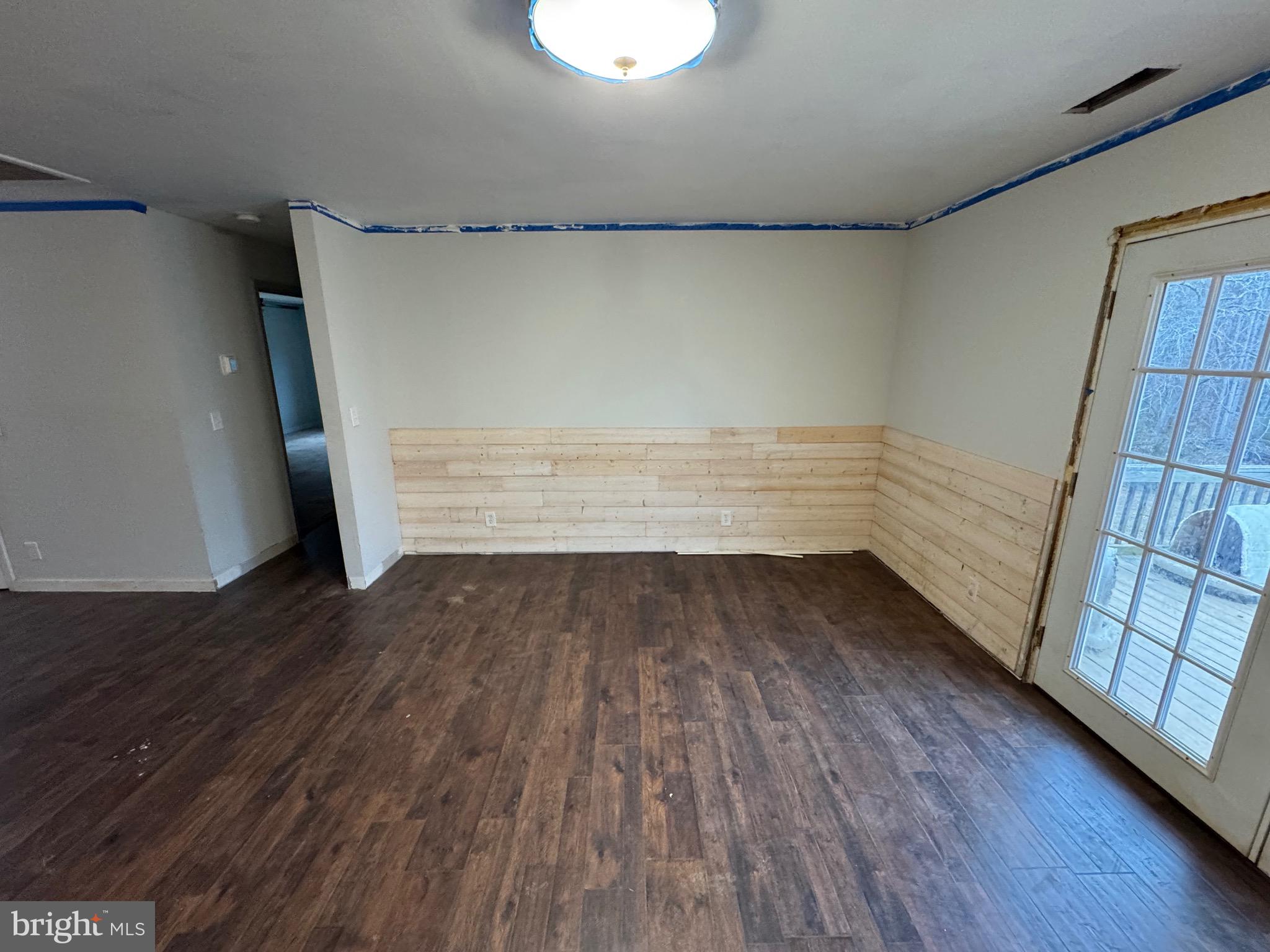 307 Dan Hall Road Mineral, VA 23117 - Photo 11 of 36 a view of empty room with wooden floor and fan