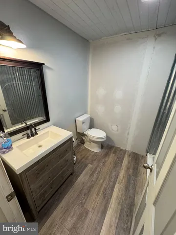 a bathroom with a sink a mirror and vanity