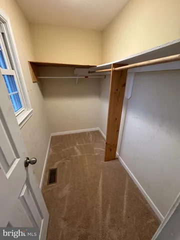 a utility room with mirror washer and dryer