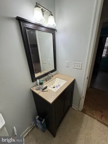 a view of a livingroom with wooden floor and stairs