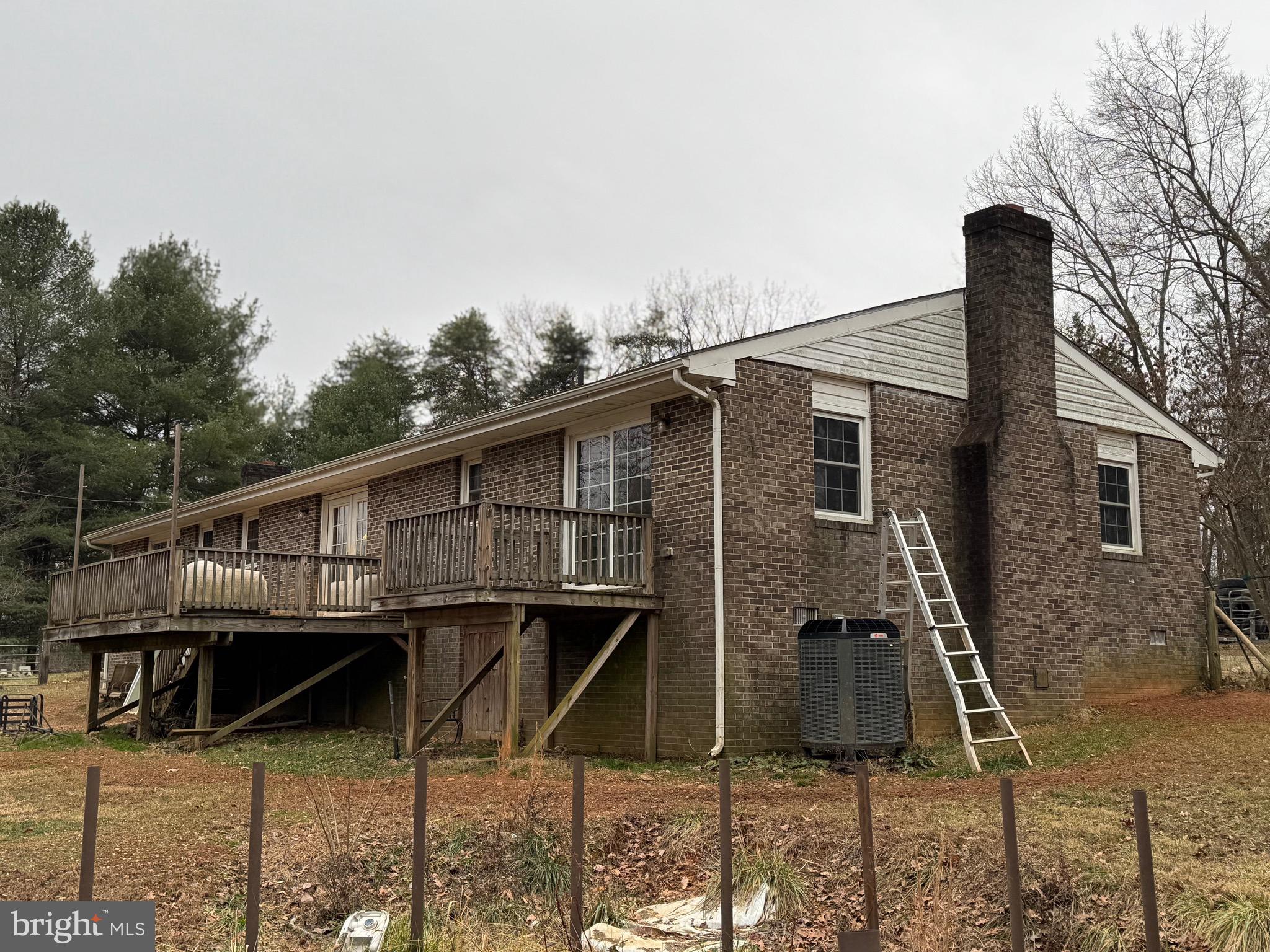 307 Dan Hall Road Mineral, VA 23117 - Photo 28 of 36 a backyard of a house with table and chairs
