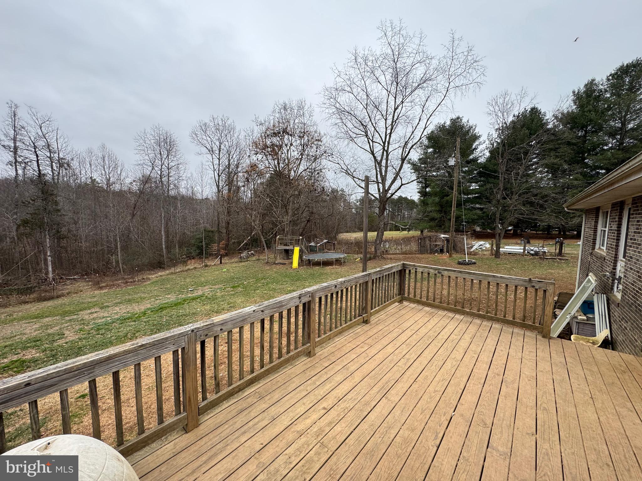 307 Dan Hall Road Mineral, VA 23117 - Photo 31 of 36 a view of a balcony with wooden floor and outdoor seating