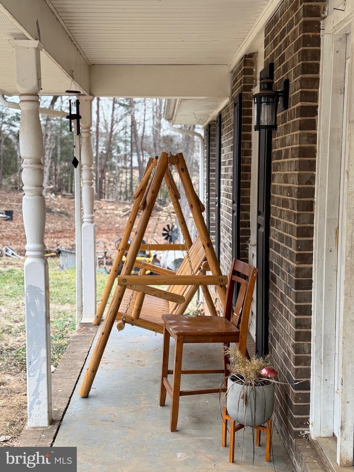 307 Dan Hall Road Mineral, VA 23117 - Photo 4 of 36 a view of staircase with a table and chairs
