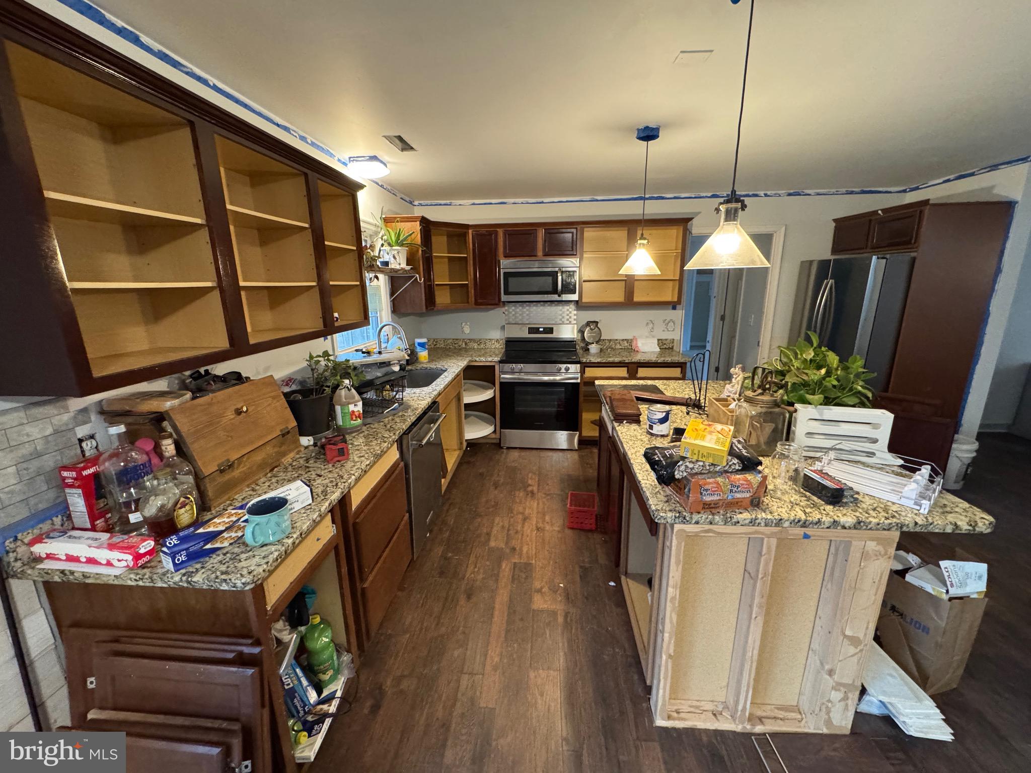 307 Dan Hall Road Mineral, VA 23117 - Photo 10 of 36 a kitchen filled with stainless steel appliances kitchen island granite countertop a stove and a refrigerator