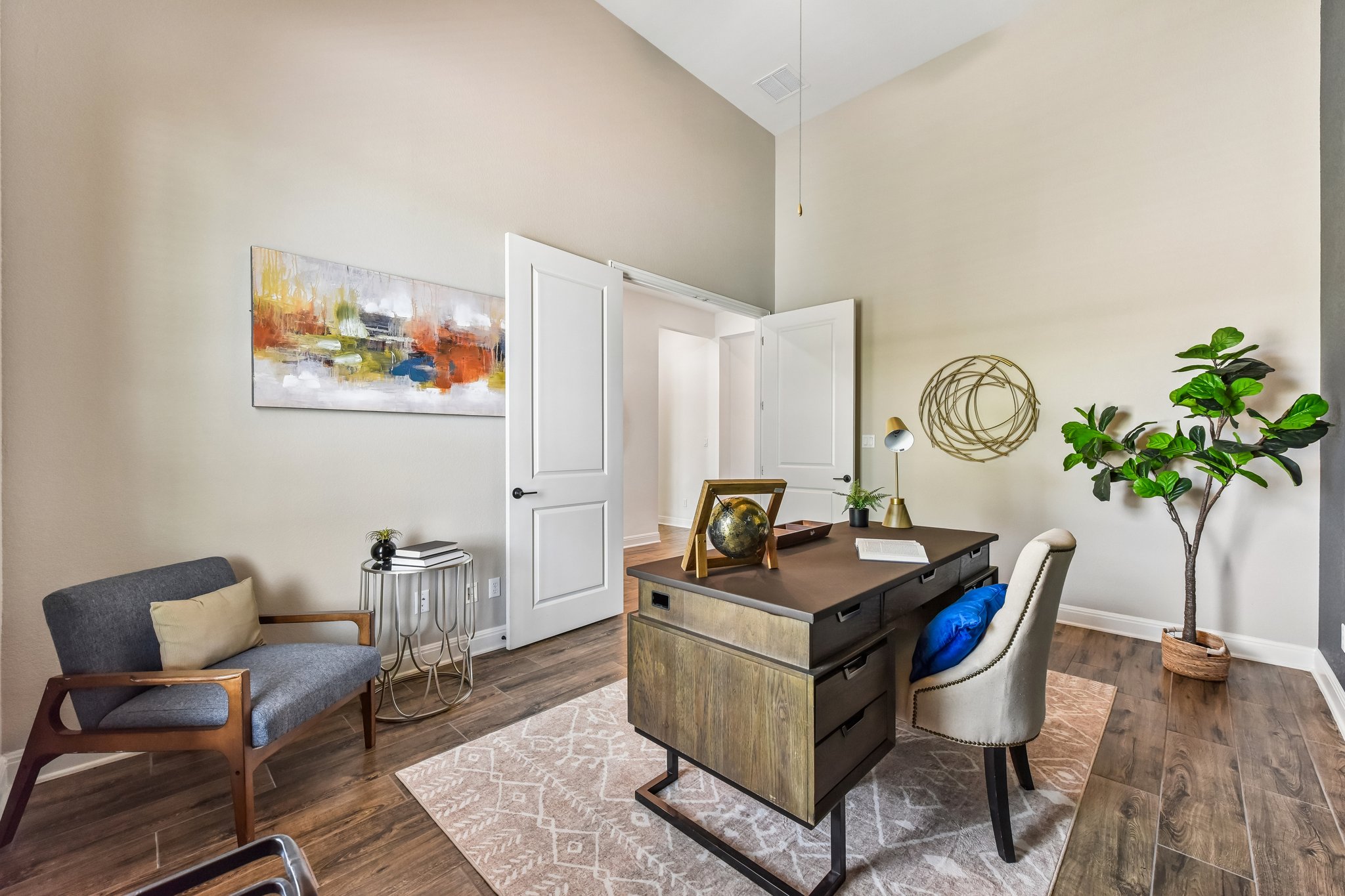 19113 Freeman Circle Austin, TX 78738 - Photo 5 of 37 High ceilings and rich wood flooring define this elegant home office space.