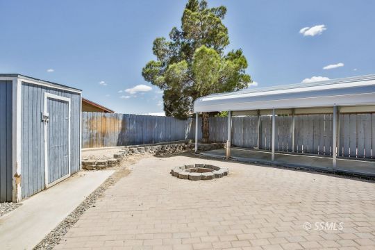 604 South Lakeview Court Ridgecrest, CA 93555 - Photo 27 of 29 a front view of a house with a yard and garage
