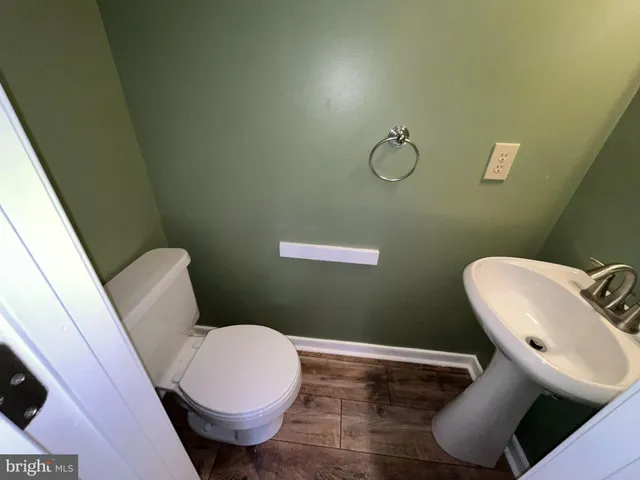a bathroom with a toilet and a sink