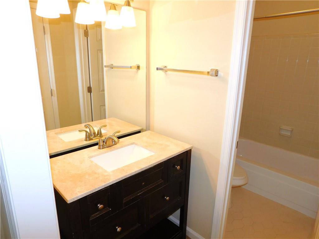1245 South Ponce De Leon Avenue Northeast, Unit C2 Atlanta, GA 30306 - Photo 20 of 27 a bathroom with a sink and a mirror