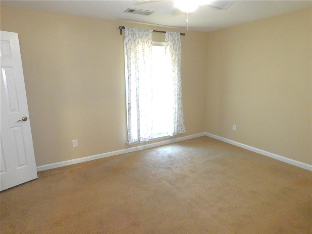 1245 South Ponce De Leon Avenue Northeast, Unit C2 Atlanta, GA 30306 - Photo 21 of 27 an empty room with a empty space and a window