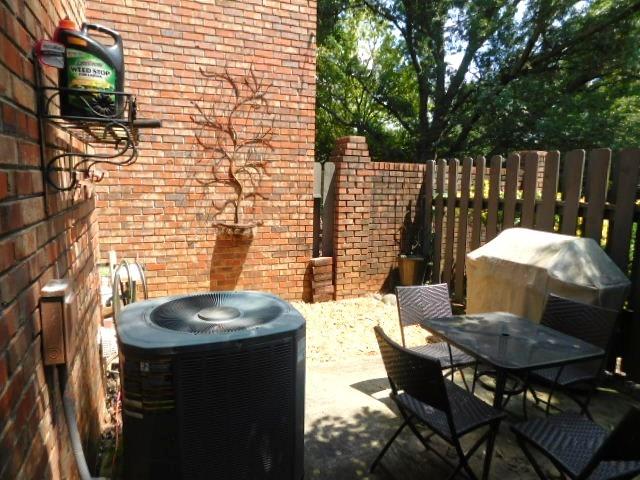 1245 South Ponce De Leon Avenue Northeast, Unit C2 Atlanta, GA 30306 - Photo 26 of 27 a backyard of a house with table and chairs