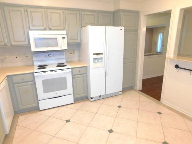 1245 South Ponce De Leon Avenue Northeast, Unit C2 Atlanta, GA 30306 - Photo 4 of 27 a kitchen with white cabinets and white appliances