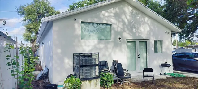 a backyard of a house with seating space