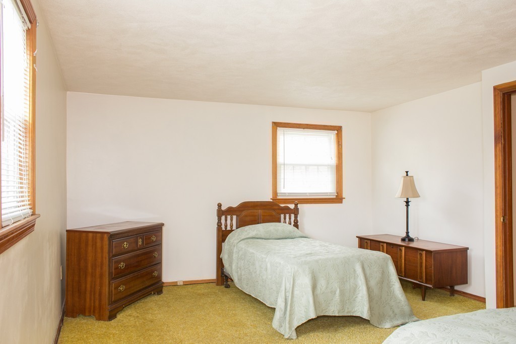32 Eastside Road Wrentham, MA 02093 - Photo 12 of 20 a bedroom with a bed and a window