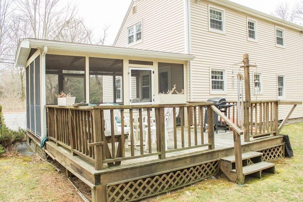 32 Eastside Road Wrentham, MA 02093 - Photo 17 of 20 a balcony with a small yard and large window