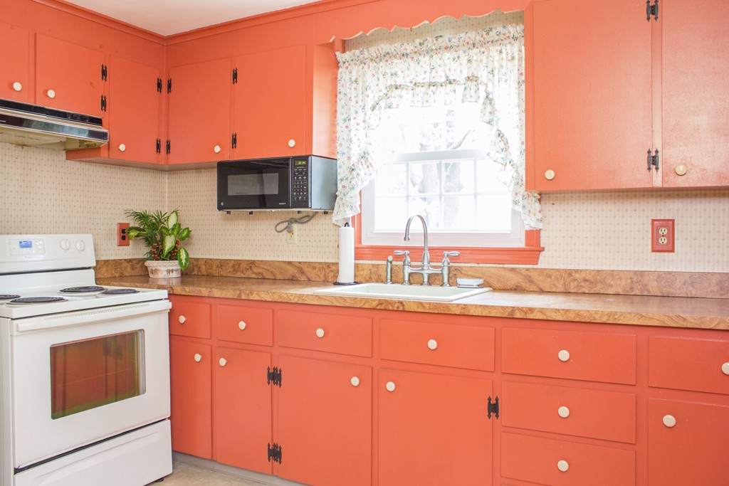 32 Eastside Road Wrentham, MA 02093 - Photo 4 of 20 a kitchen with granite countertop a sink and a stove