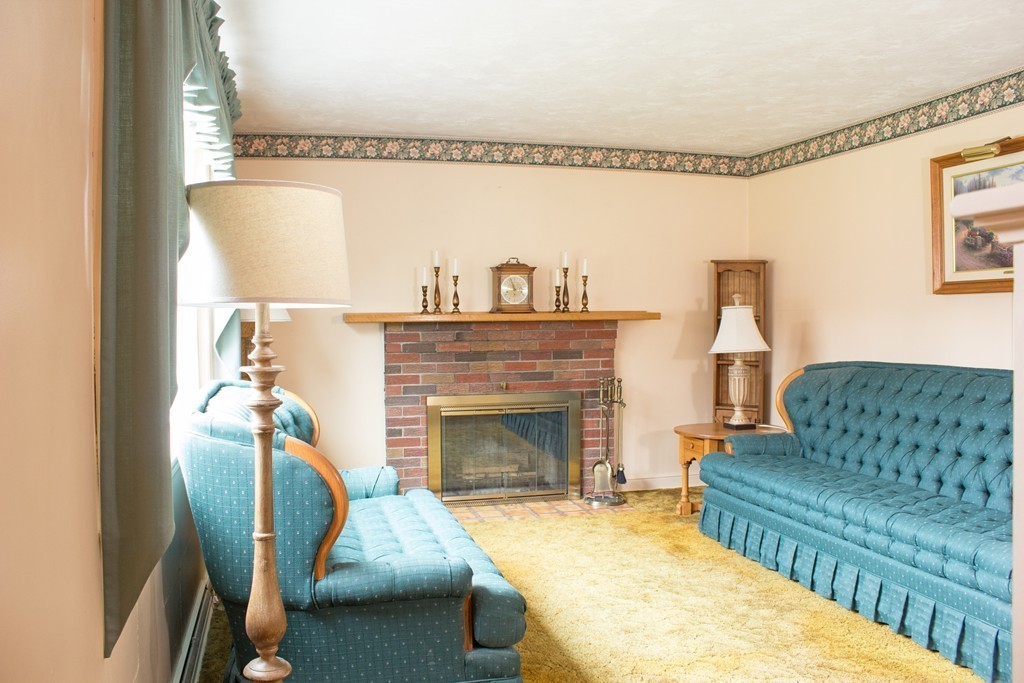 32 Eastside Road Wrentham, MA 02093 - Photo 6 of 20 a living room with furniture and a fireplace