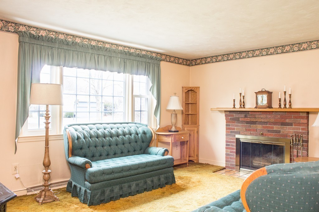 32 Eastside Road Wrentham, MA 02093 - Photo 7 of 20 a living room with furniture and a fireplace