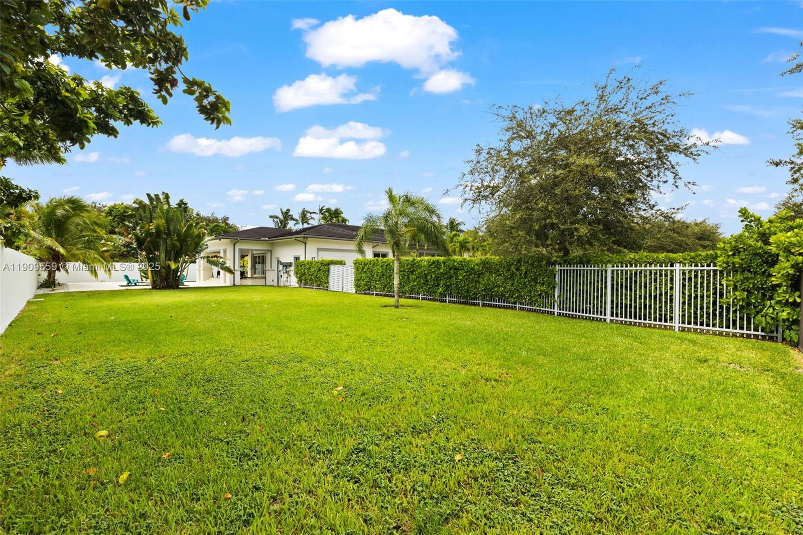 9580 Southwest 101st Terrace Miami, FL 33176 - Photo 16 of 88 a view of a garden with a lake