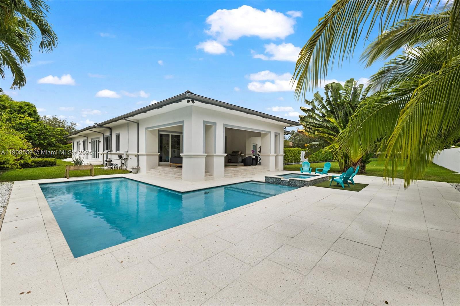 9580 Southwest 101st Terrace Miami, FL 33176 - Photo 18 of 88 a view of a house with backyard and swimming pool