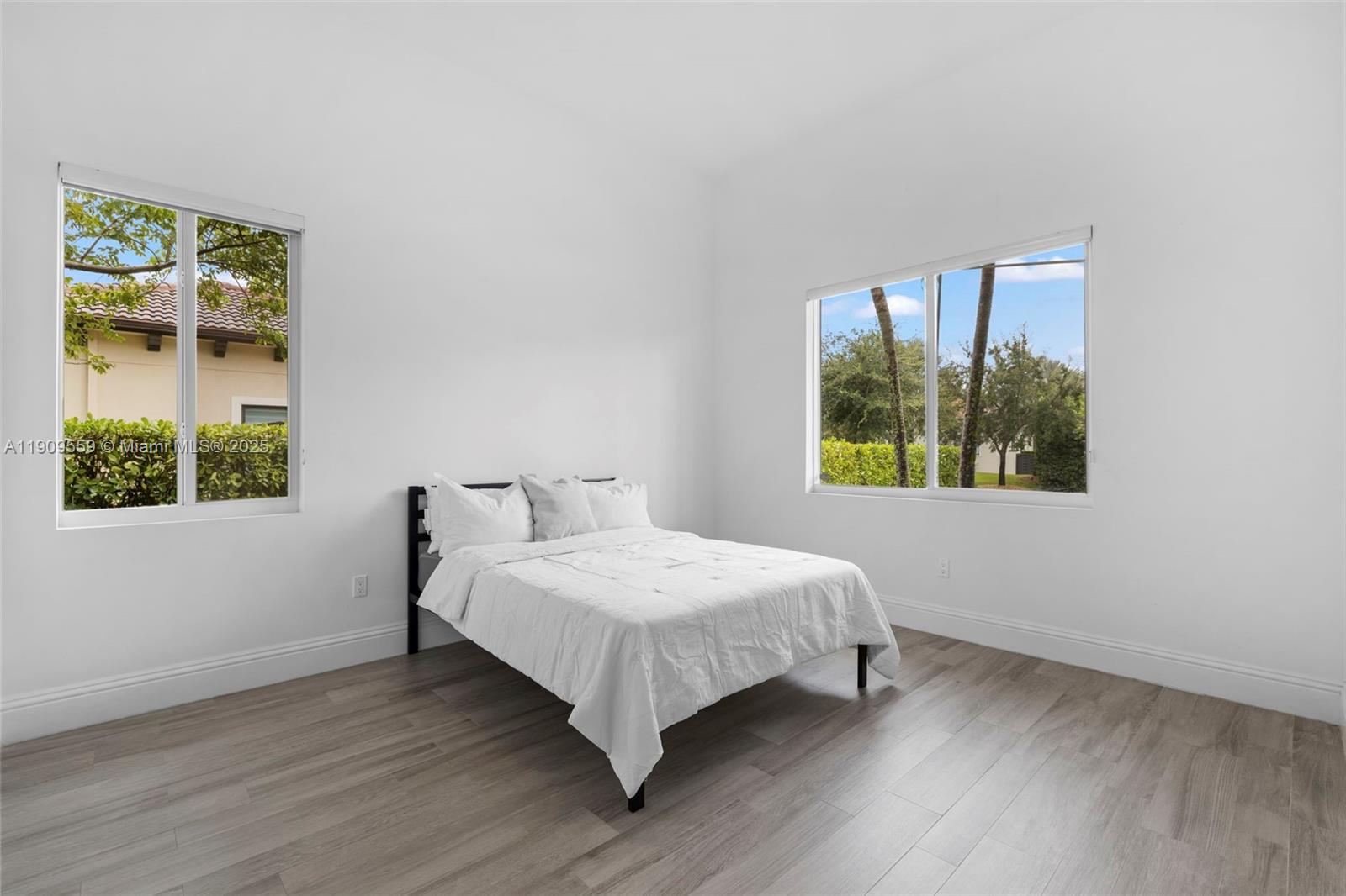 9580 Southwest 101st Terrace Miami, FL 33176 - Photo 26 of 88 a bedroom with a bed and a window